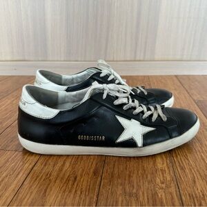 Golden Goose Black and White Sneakers with Vintage-Inspired Design $225